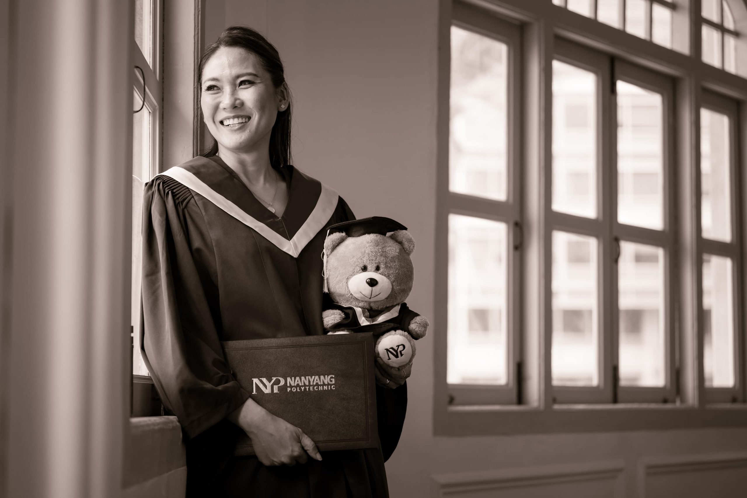 Professional Family and Graduation Photoshoot in Photography Studio, Singapore Graduate smiling during a graduation photoshoot at White Room Studio