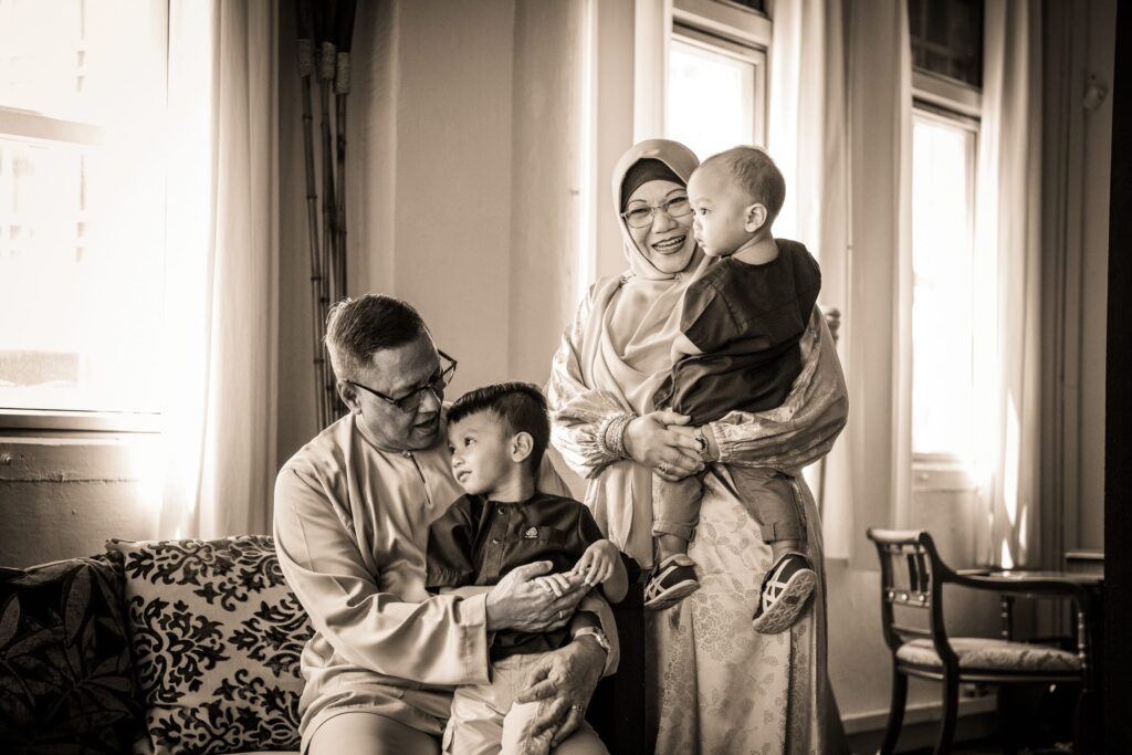 Professional Family and Graduation Photoshoot in Photography Studio, Singapore Family with grandparents and their grandchildren in a photography studio setting during a graduation photoshoot in Singapore, White Room Studio. Credit: White Room Studio Pte Ltd