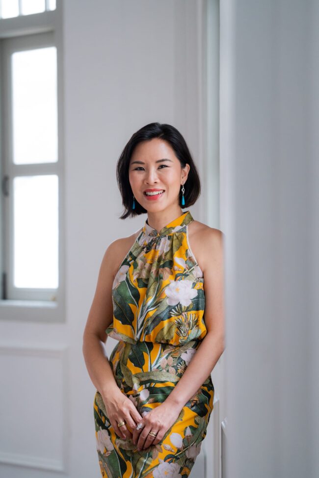 Professional Corporate & Company Photoshoot in Photography Studio, Singapore Professional female public speaker posing for headshot in a photography studio setting during a corporate photoshoot in Singapore, White Room Studio. Credit: White Room Studio Pte Ltd