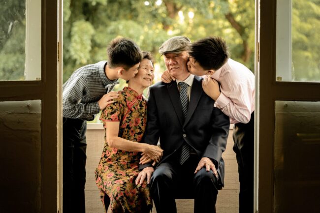 Family with grandparents, parents and their children during a family photoshoot in Singapore, White Room Studio. Credit: White Room Studio Pte Ltd