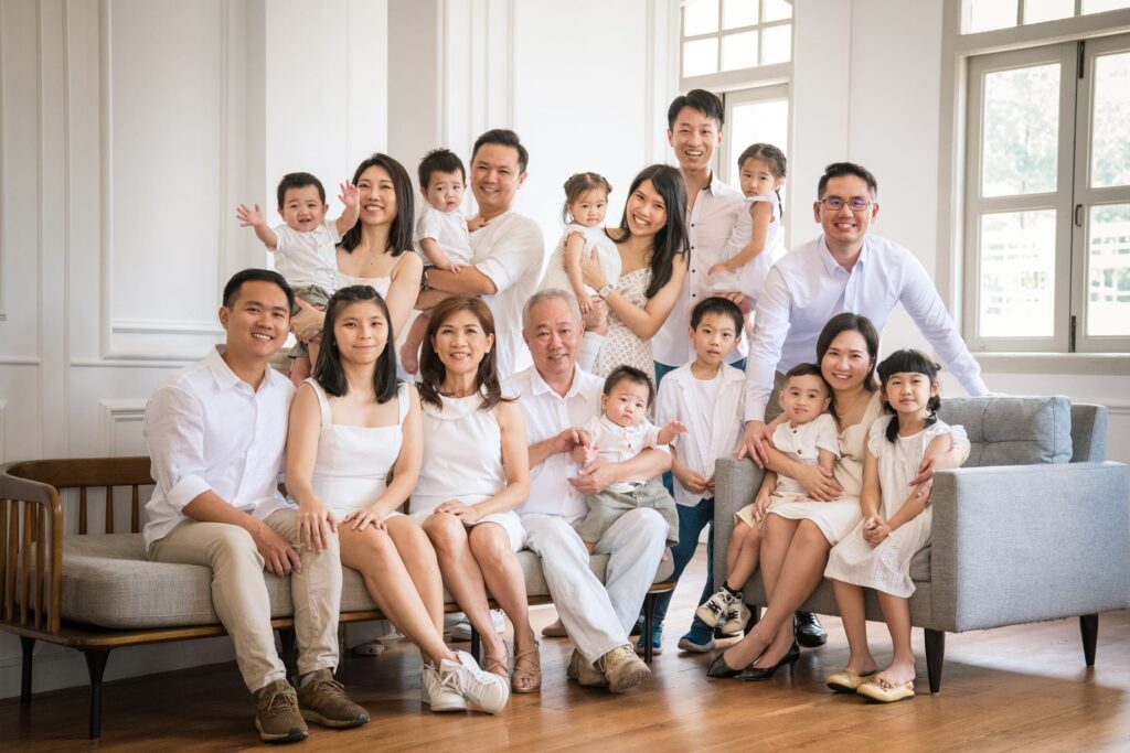 Family with grandparents, parents and their children during a family photoshoot in Singapore, White Room Studio. Credit: White Room Studio Pte Ltd