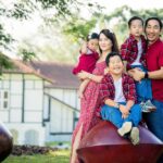 Three-Kids family portrait photographed in outdoor setting photographed by White Room Studio, 219 River Valley Road, Singapore. Natural light family portrait 2026