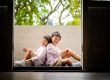 Best Singapore family photo studio, Family with parents and their children with kids ages ranging from toddler to teens in a photography studio setting during a family photoshoot in Singapore, White Room Studio. Credit: White Room Studio Pte Ltd