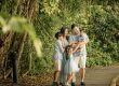 Family with parents and their children with kids ages ranging from toddler to teens in a photography outdoor setting during an family photoshoot in Singapore. Credit: White Room Studio Pte Ltd