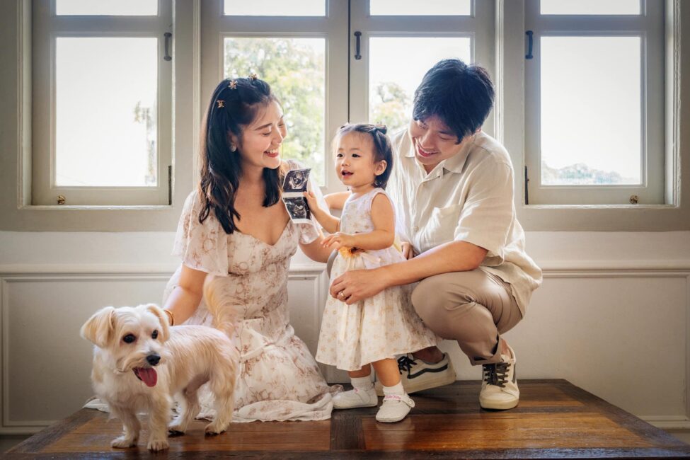 Best Singapore family photo studio, Family with parents and their children with kids ages ranging from toddler to teens in a photography studio setting during a family photoshoot in Singapore, White Room Studio. Credit: White Room Studio Pte Ltd