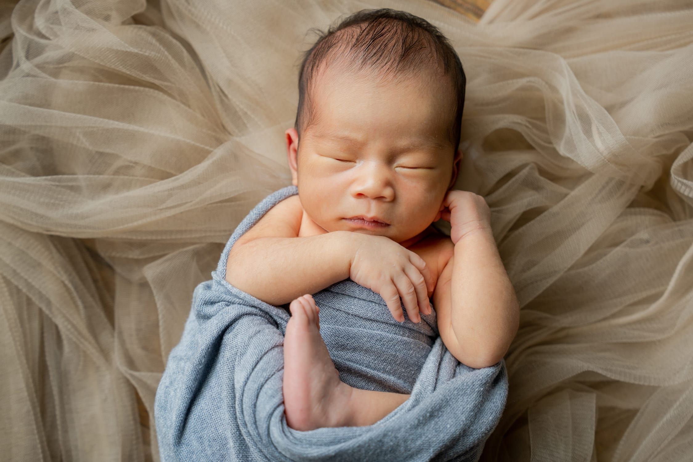 Newborn Photoshoot Wrapped in Blue Swaddle and Mesh Studio Photography White Room Studio 219 River Valley Singapore Newborn Photoshoot Wrapped in Blue Swaddle and Mesh Studio Photography White Room Studio 219 River Valley Singapore