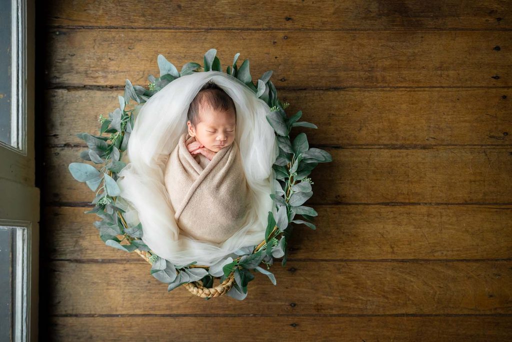 Sleeping newborn baby during a safe gentle newborn photoshoot at White Room Studio, Singapore