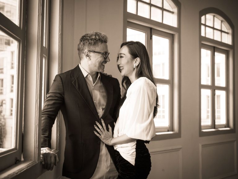 Engaged and married couple in a photography studio setting during a wedding photoshoot in Singapore, White Room Studio. Credit: White Room Studio Pte Ltd