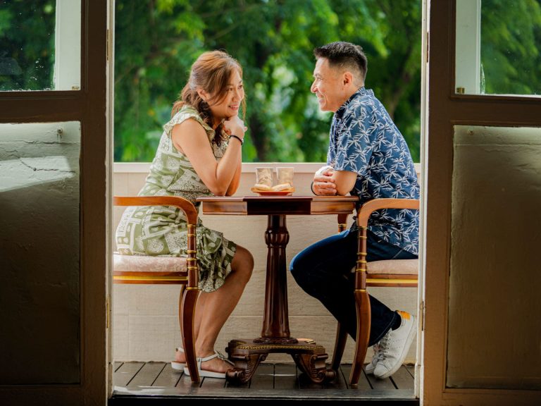 Engaged and married couple in a photography studio setting during a wedding photoshoot in Singapore, White Room Studio. Credit: White Room Studio Pte Ltd