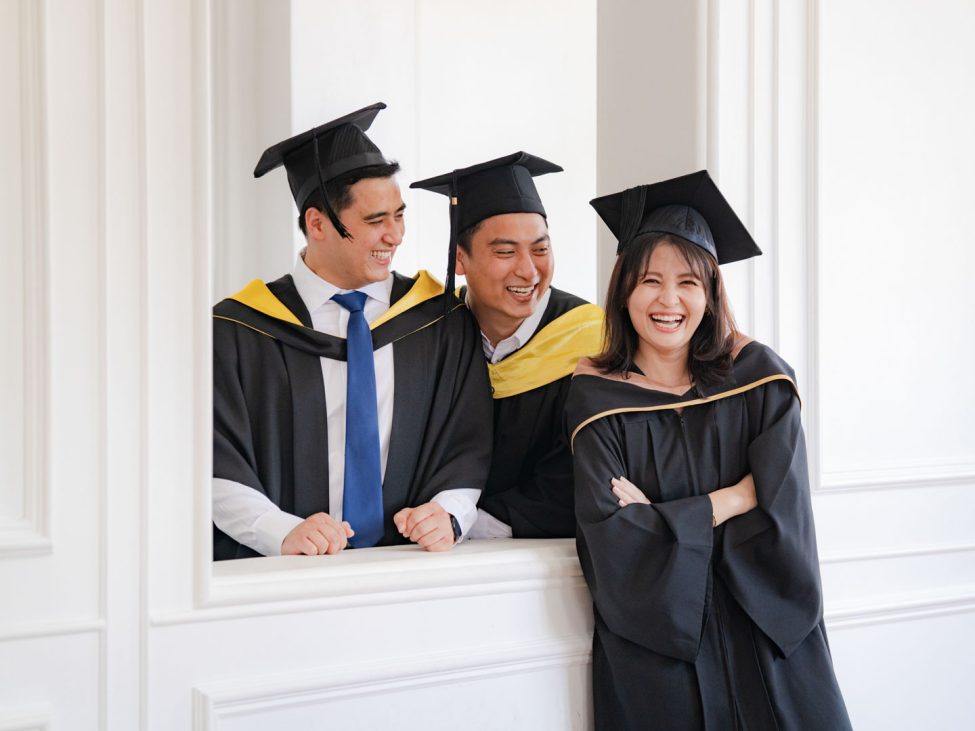 adults in a photography studio setting during a graduation photoshoot in Singapore, White Room Studio. Credit: White Room Studio Pte Ltd