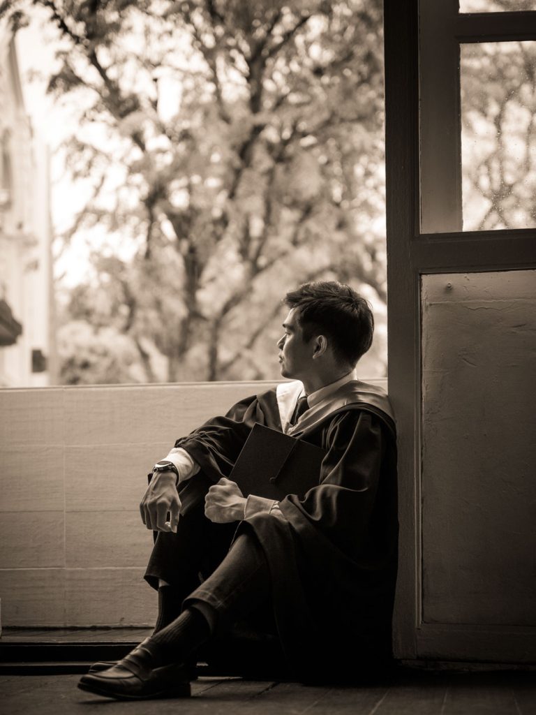adults in a photography studio setting during a graduation photoshoot in Singapore, White Room Studio. Credit: White Room Studio Pte Ltd