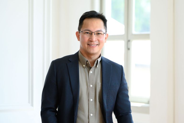 Professional corporate headshot photographed in natural light photo studio at White Room Studio, 219 River Valley Road Singapore