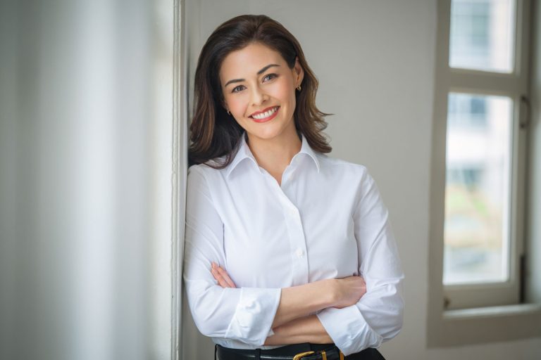 Professional corporate headshot photographed in natural light at White Room Studio, 219 River Valley Road Singapore