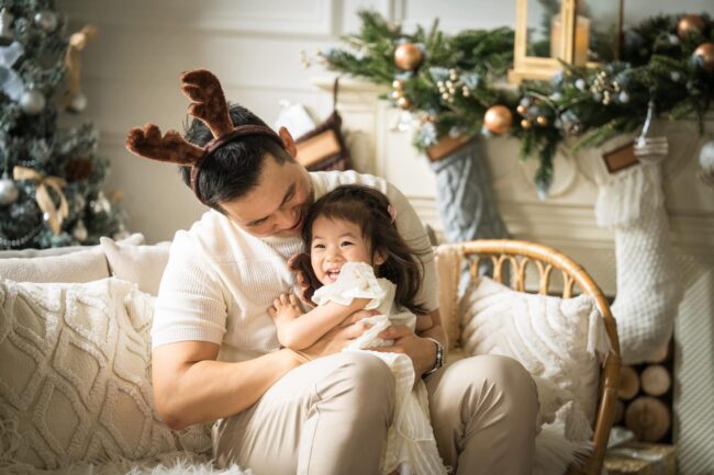 Professional Family & Multi Generation Photoshoot in Photography Studio, Singapore Family photoshoot of a little girl in natural light Christmas photo studio setup at White Room Studio, 219 River Valley Road Singapore