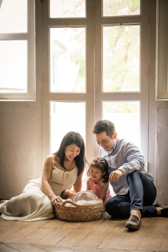 Newborn photoshoot of a family of four at White Room Studio Singapore