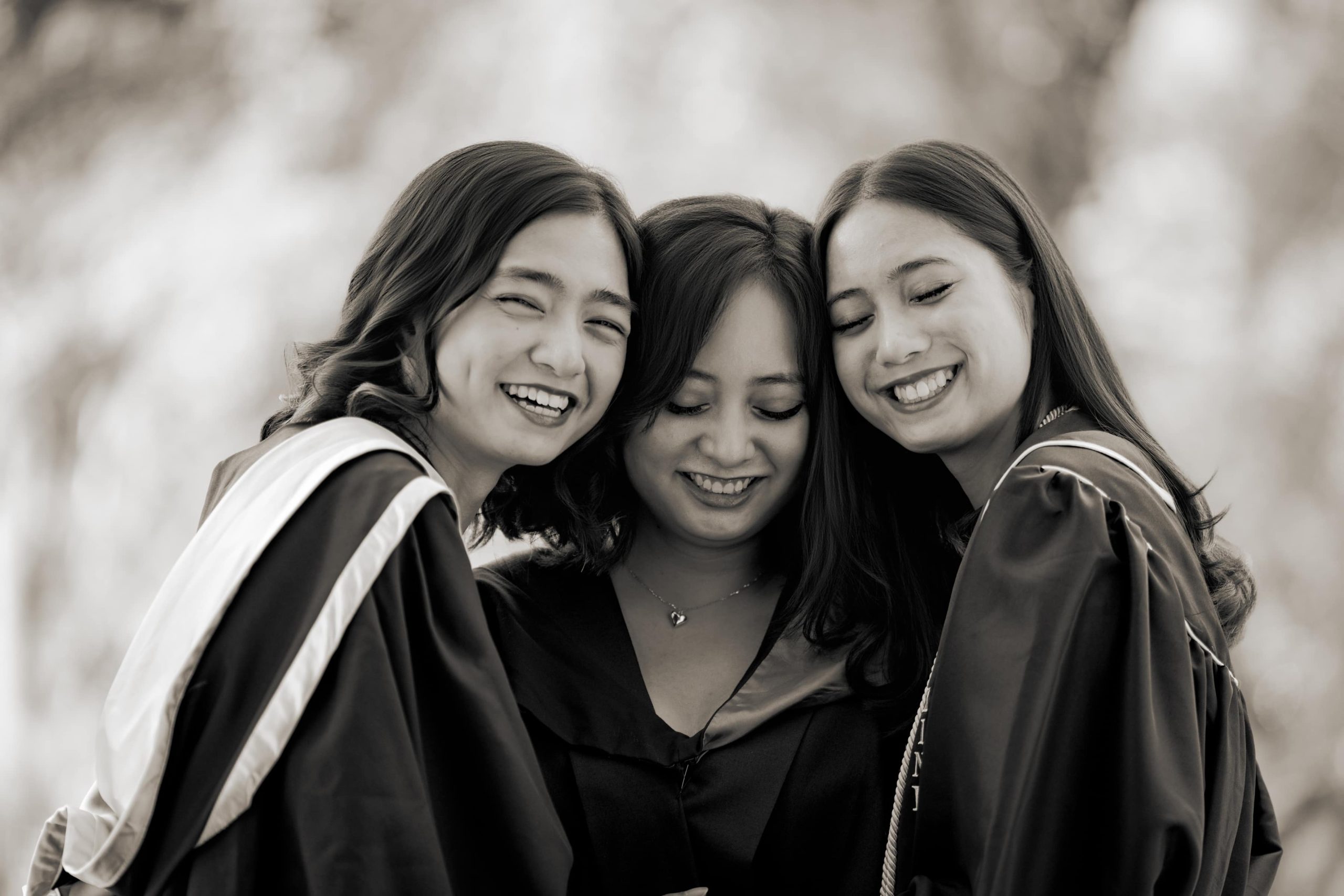 Graduation photoshoot of three daughters in natural light photo studio at White Room Studio, 219 River Valley Road Singapore