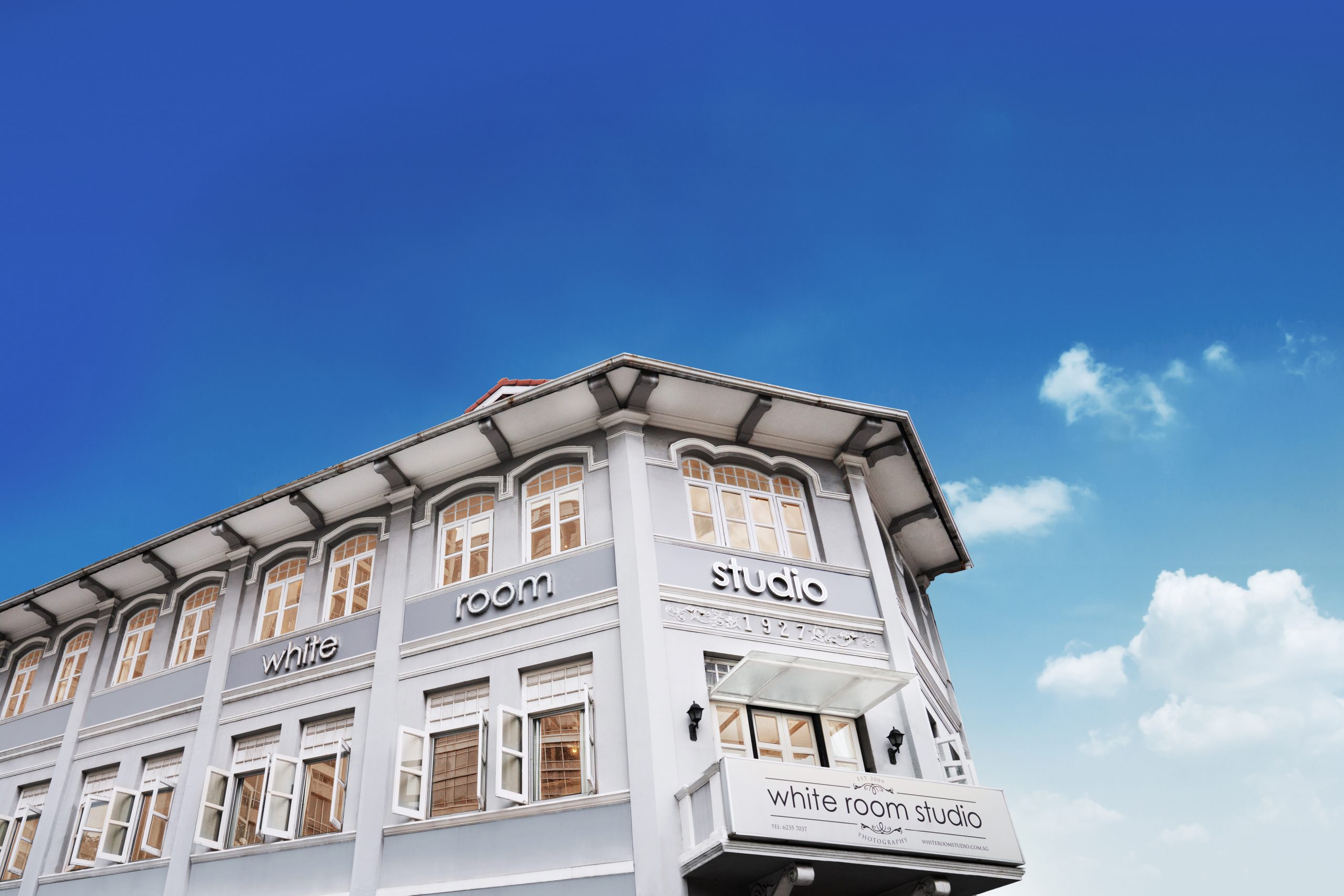 Family-Photoshoot-Singapore-Photography-Studio_white_room_studio_singapore_studio63 A two-storey shophouse photography studio in River Valley, Singapore taken against a blue sky Credit: White Room Studio