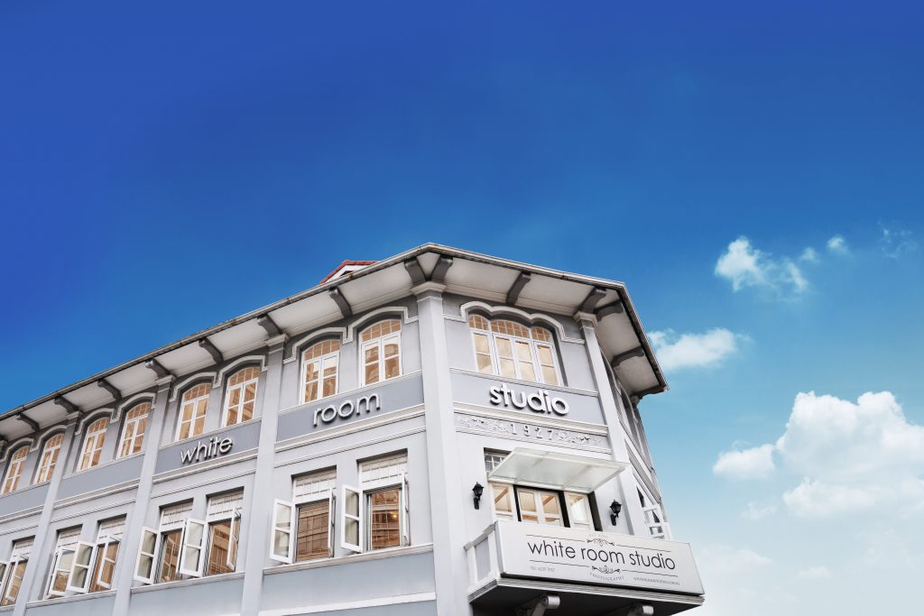 A two-storey shophouse photography studio in River Valley, Singapore taken against a blue sky Credit: White Room Studio