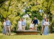 Family with parents and their children with kids ages ranging from toddler to teens in a photography studio setting during an outdoor family photoshoot in Singapore. Credit: White Room Studio Pte Ltd
