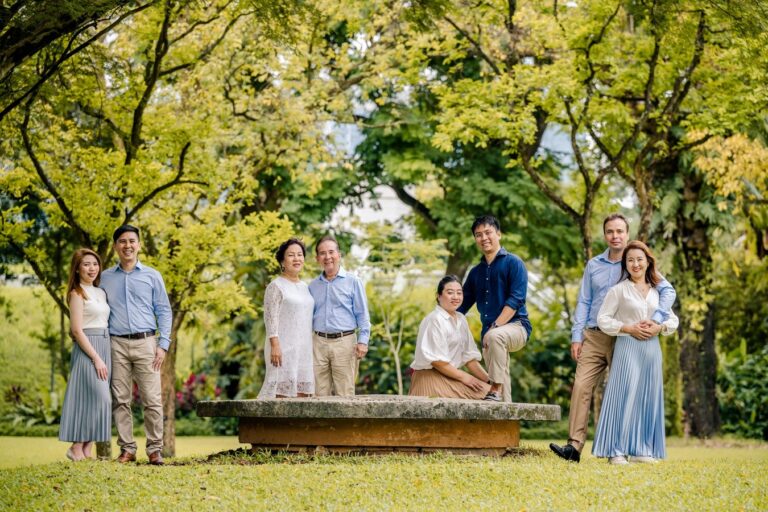 Family with parents and their children with kids ages ranging from toddler to teens in a photography studio setting during an outdoor family photoshoot in Singapore. Credit: White Room Studio Pte Ltd