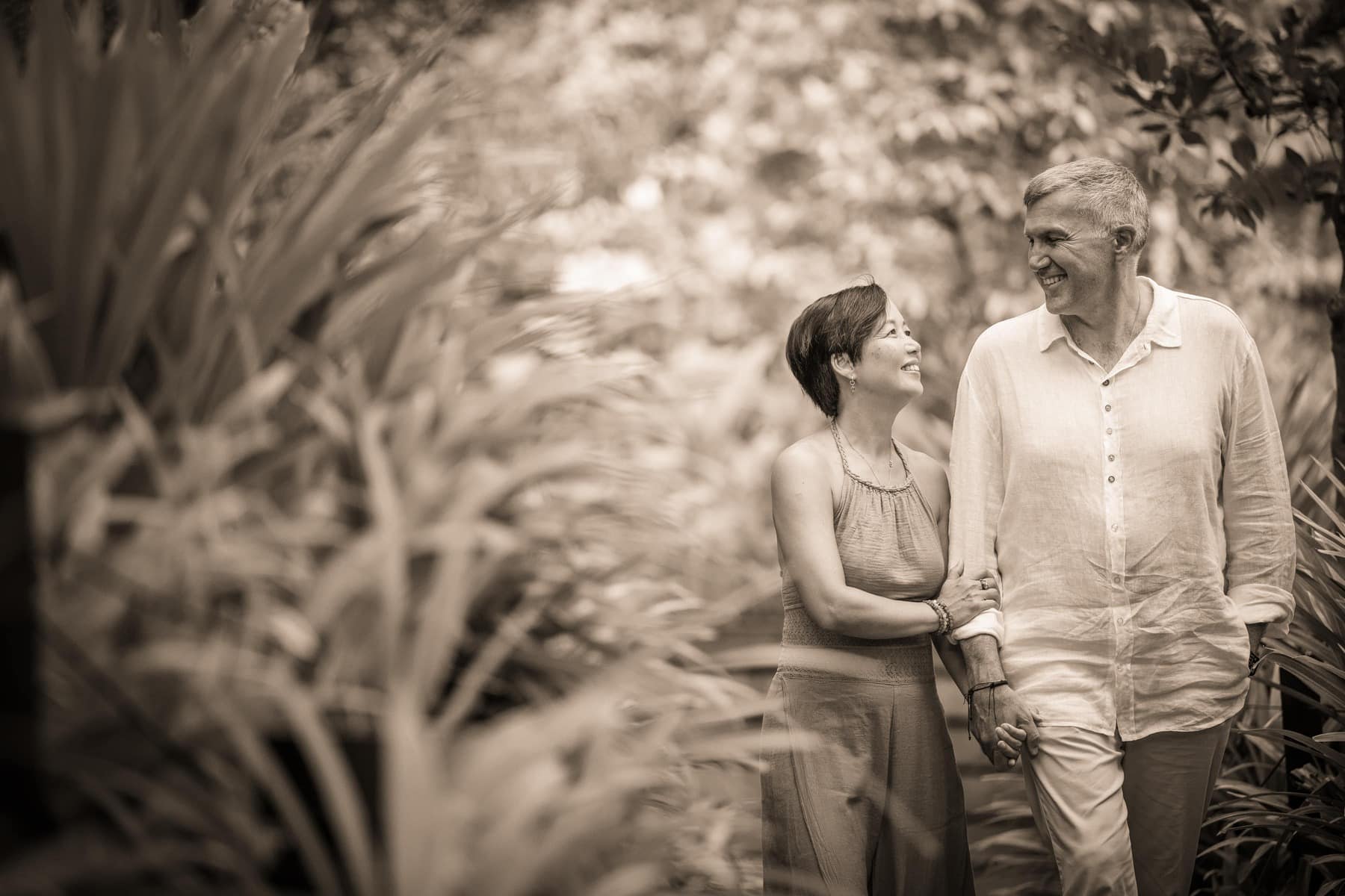 Professional Family & Multi Generation Photoshoot in Photography Studio, Singapore Couple photography during an outdoor family photoshoot in Singapore. Credit: White Room Studio Pte Ltd