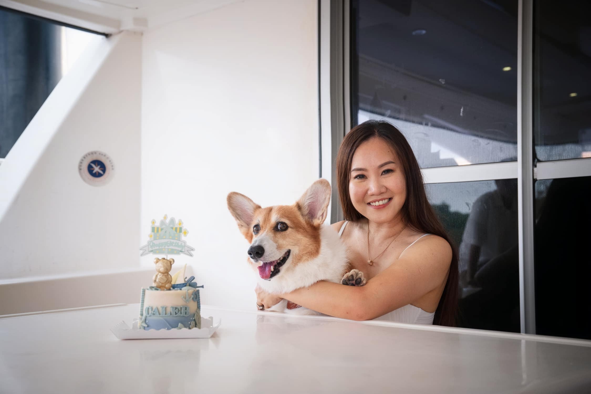 Family-Photoshoot-Singapore-Photography-Studio_##64 Outdoor Pet Photoshoot with Caleb during a Yacht Birthday Celebration Credit: White Room Studio Pte Ltd