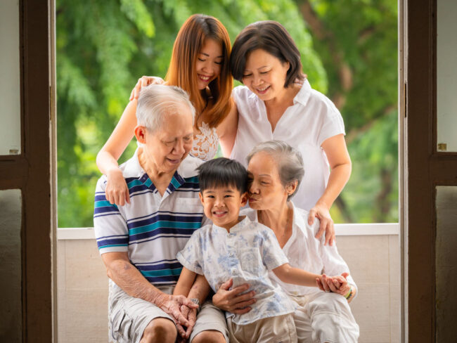 Professional Family & Multi Generation Photoshoot in Photography Studio, Singapore Family with parents and their toddler in a photography studio setting during an family photoshoot in Singapore. Credit: White Room Studio Pte Ltd